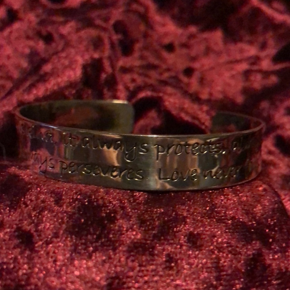 Silver bracelet fits up to 8” wrist.  No brand.